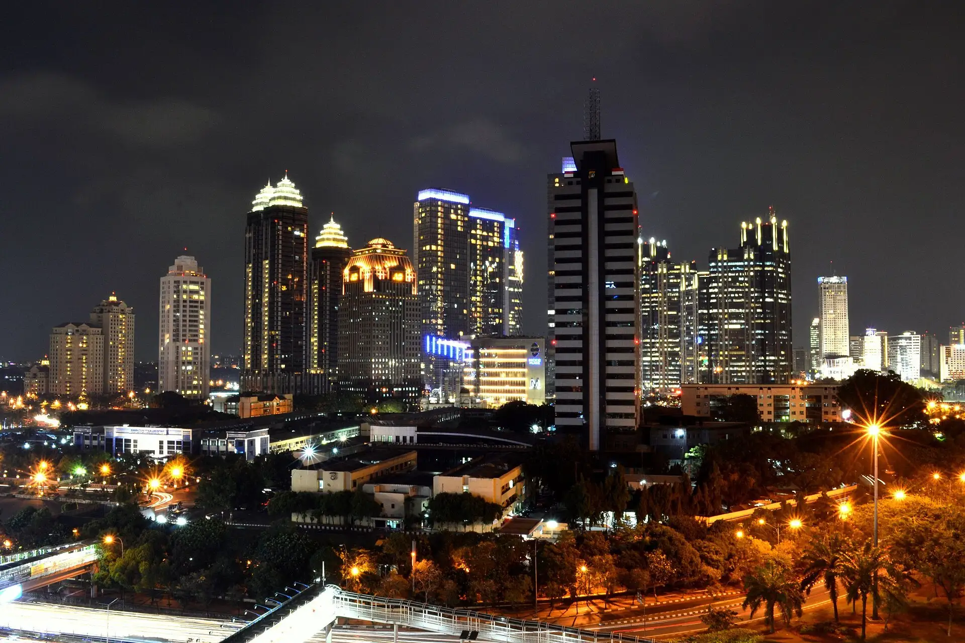 Jakarta’s skyline at night, the towers of the SCBD business district lit up above the city